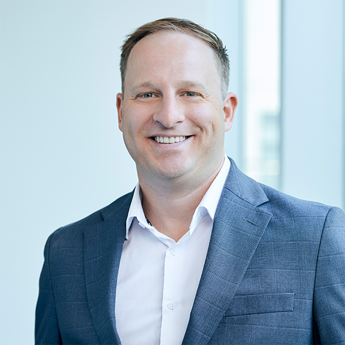 Essex Realty Group’s new Director, Joe Kahlhammer, a top Chicago multifamily broker, in a professionally lit photo