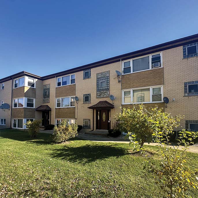 9-unit multifamily building at 7522 W. Lawrence Avenue, sold by Essex Realty Group, ideal for real estate investing Chicago.